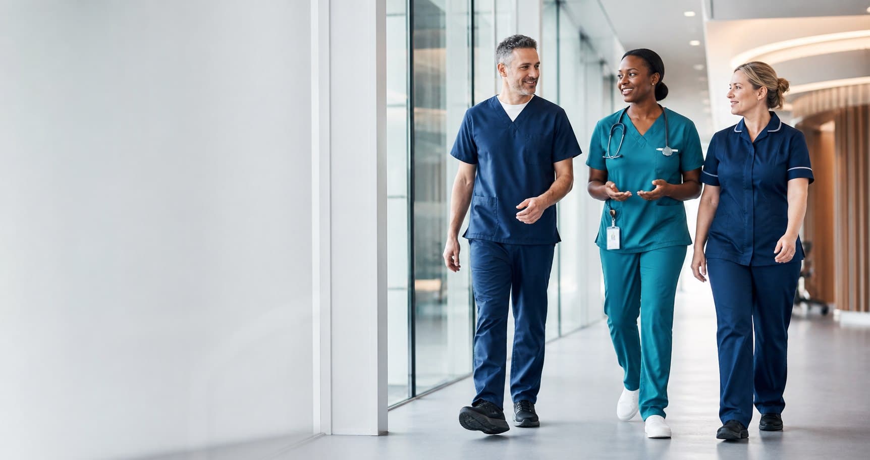A diverse team of healthcare professionals in a modern hospital